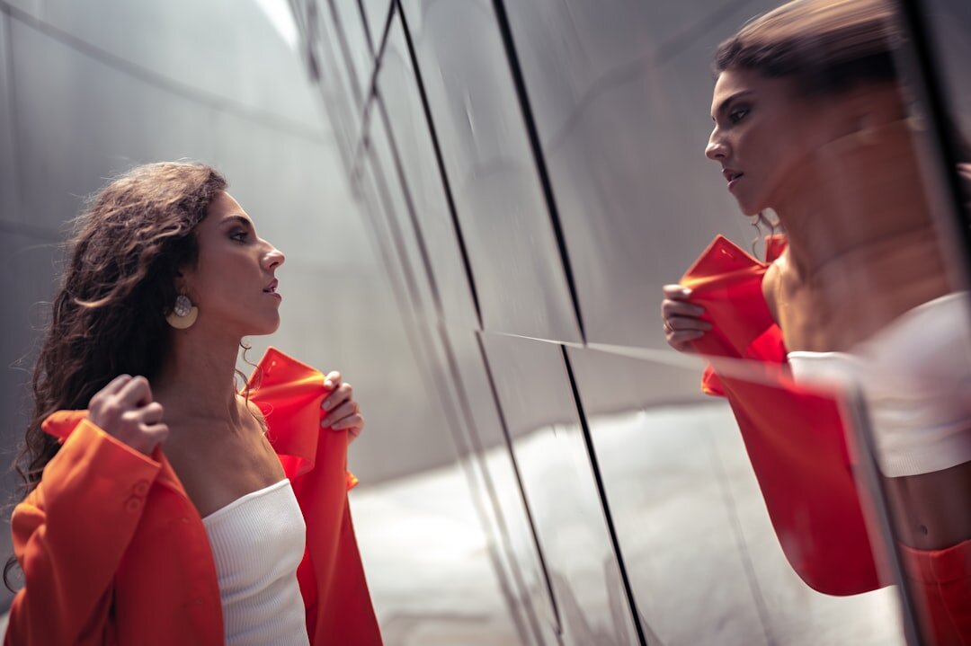 woman empowering herself in mirror