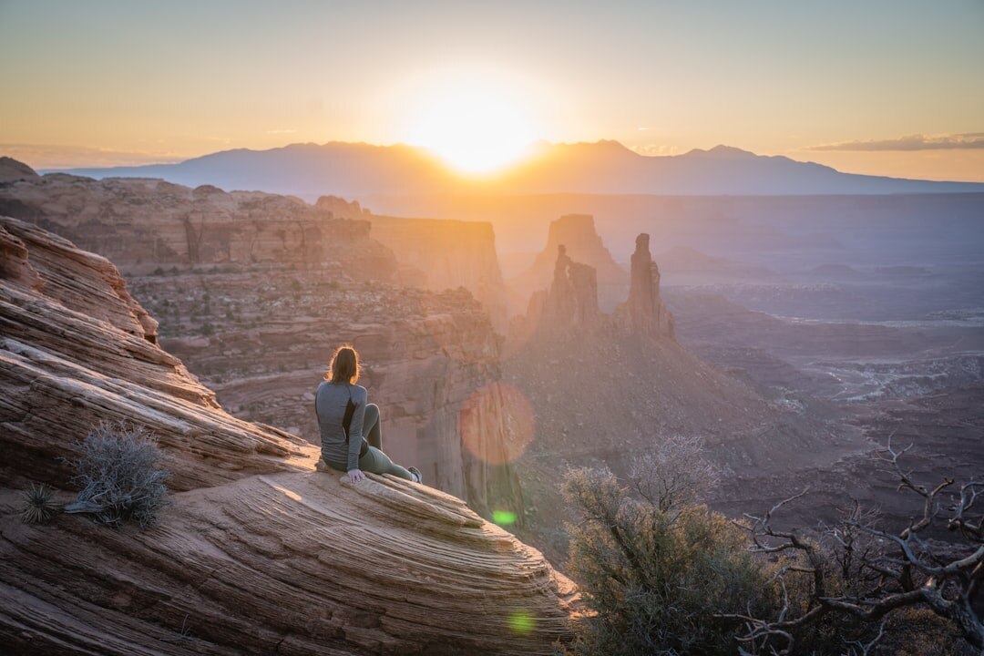 woman meditating at sunrise