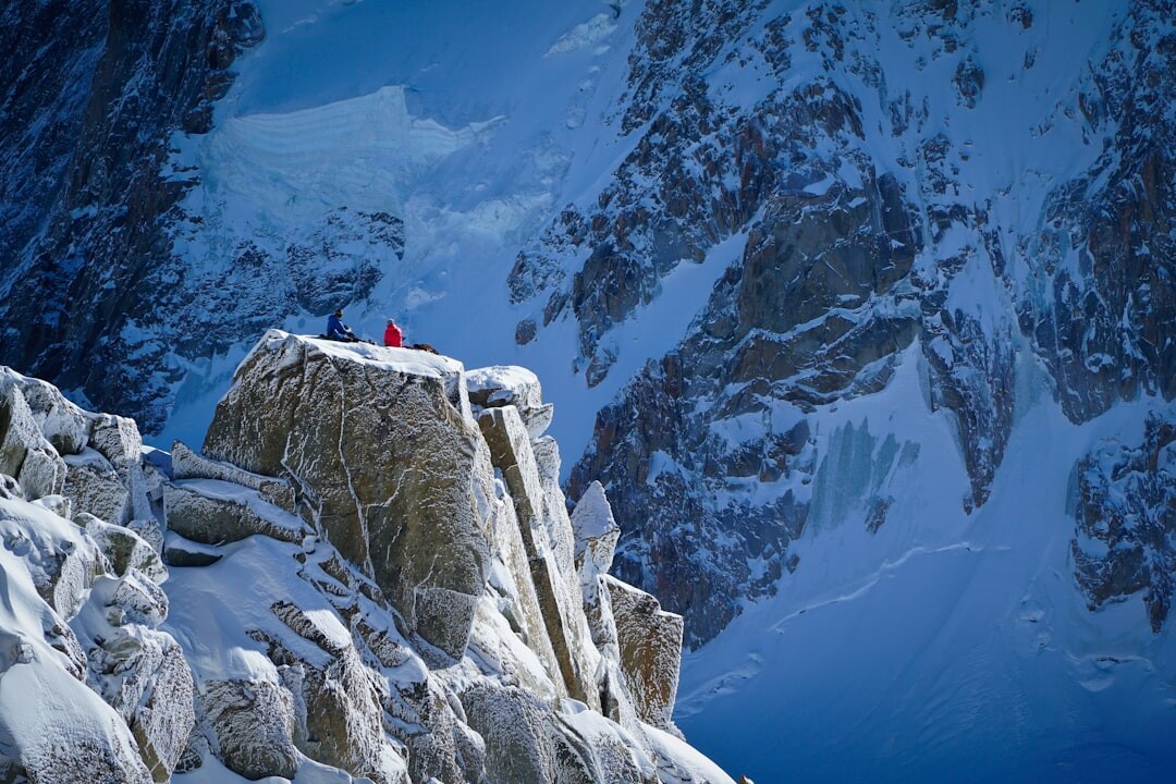 person climbing mountain