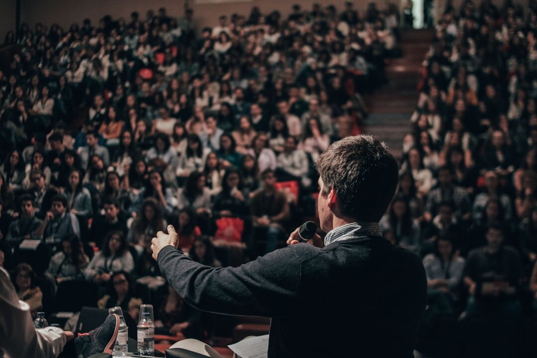 Person presenting ideas to a small seated audience